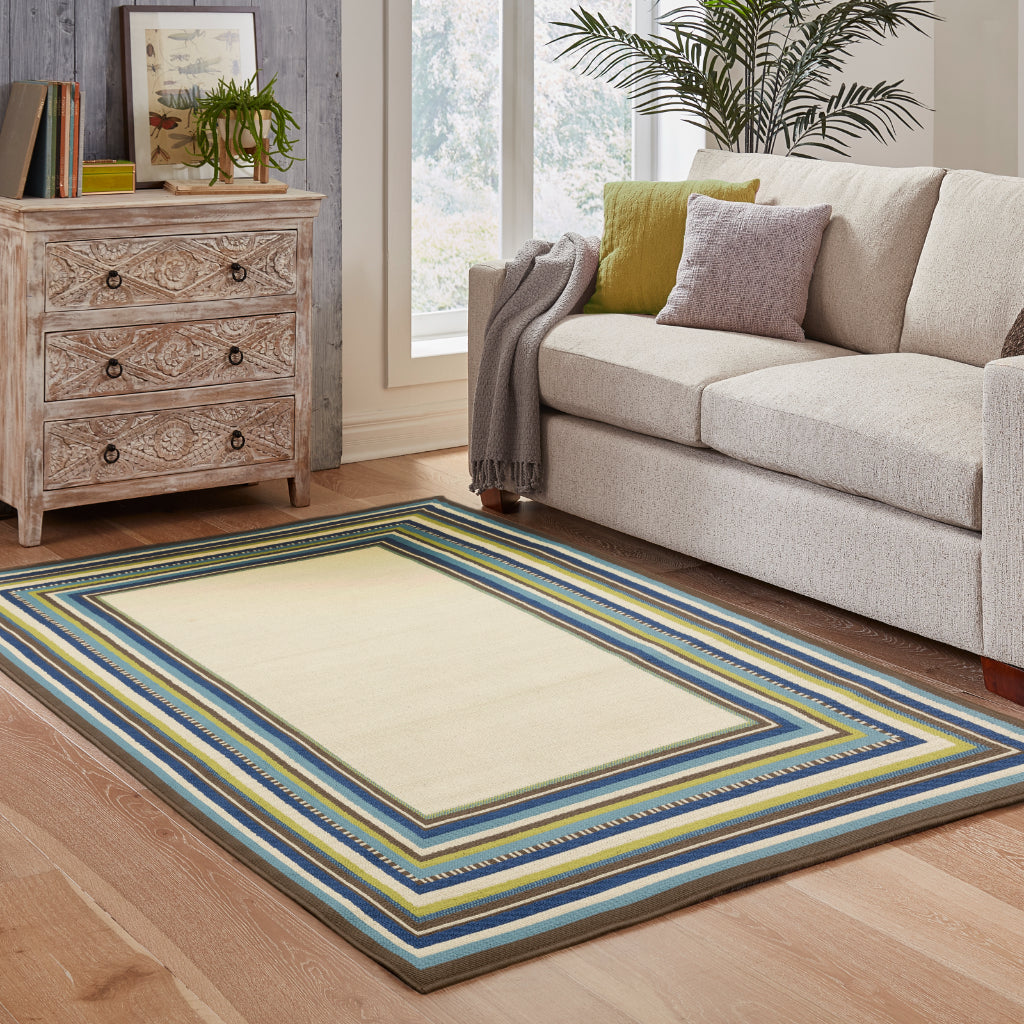 Oriental Weavers Caspian 1003X Ivory/Blue Rectangle Indoor / Outdoor Area Rug - Durable Stain Resistant Machine Made Patio Rug with Border Pattern