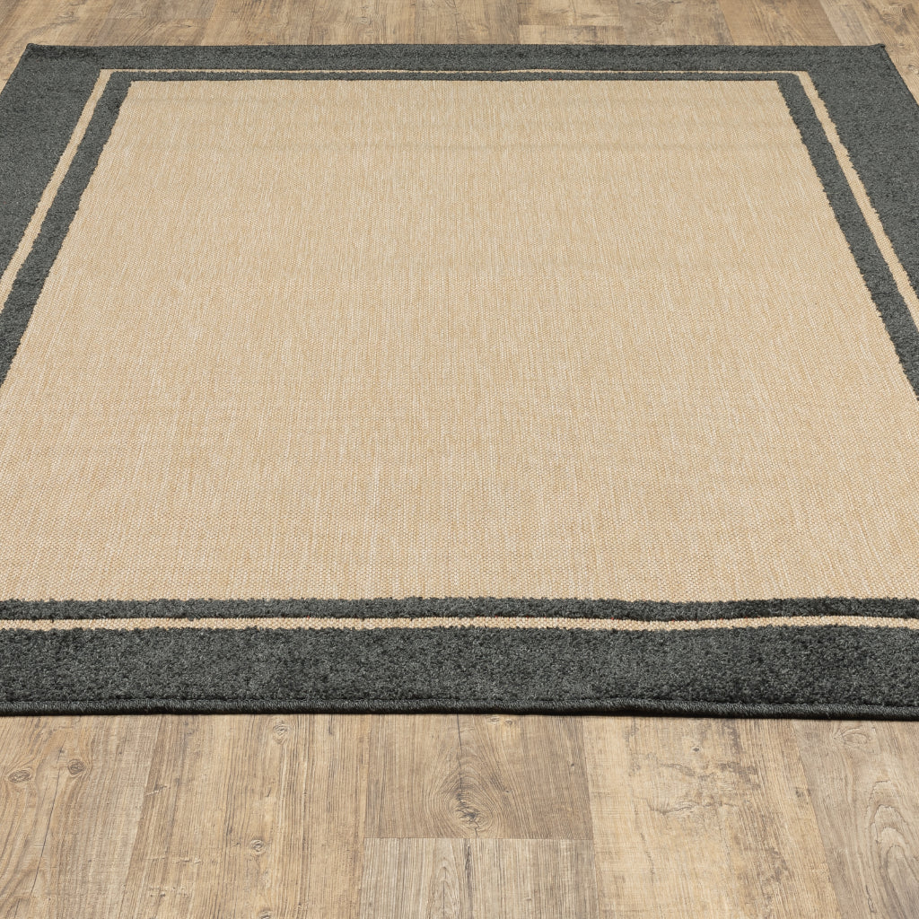 Oriental Weavers Cayman 5594K Sand/Charcoal Rectangle Indoor / Outdoor Area Rug - Stain Resistant Machine Made Patio Rug with Border Pattern