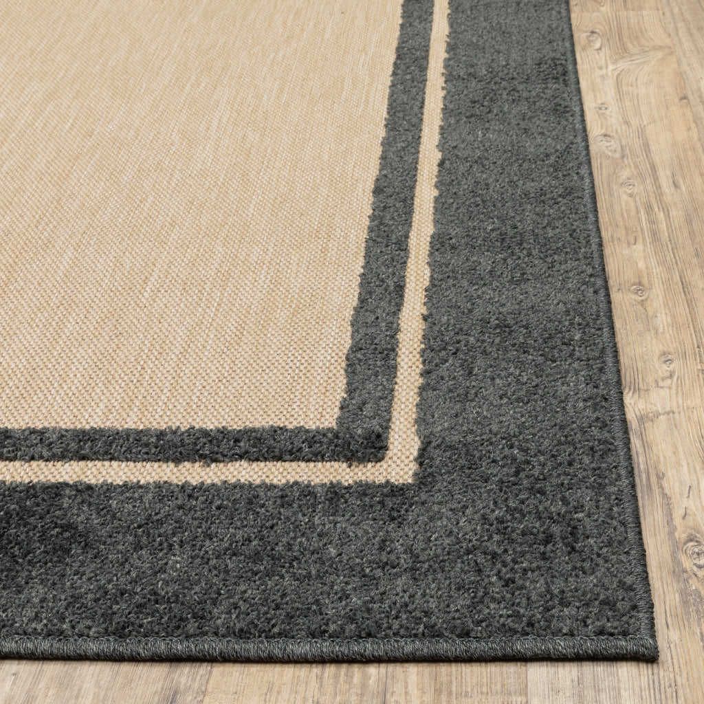 Oriental Weavers Cayman 5594K Sand/Charcoal Rectangle Indoor / Outdoor Area Rug - Stain Resistant Machine Made Patio Rug with Border Pattern